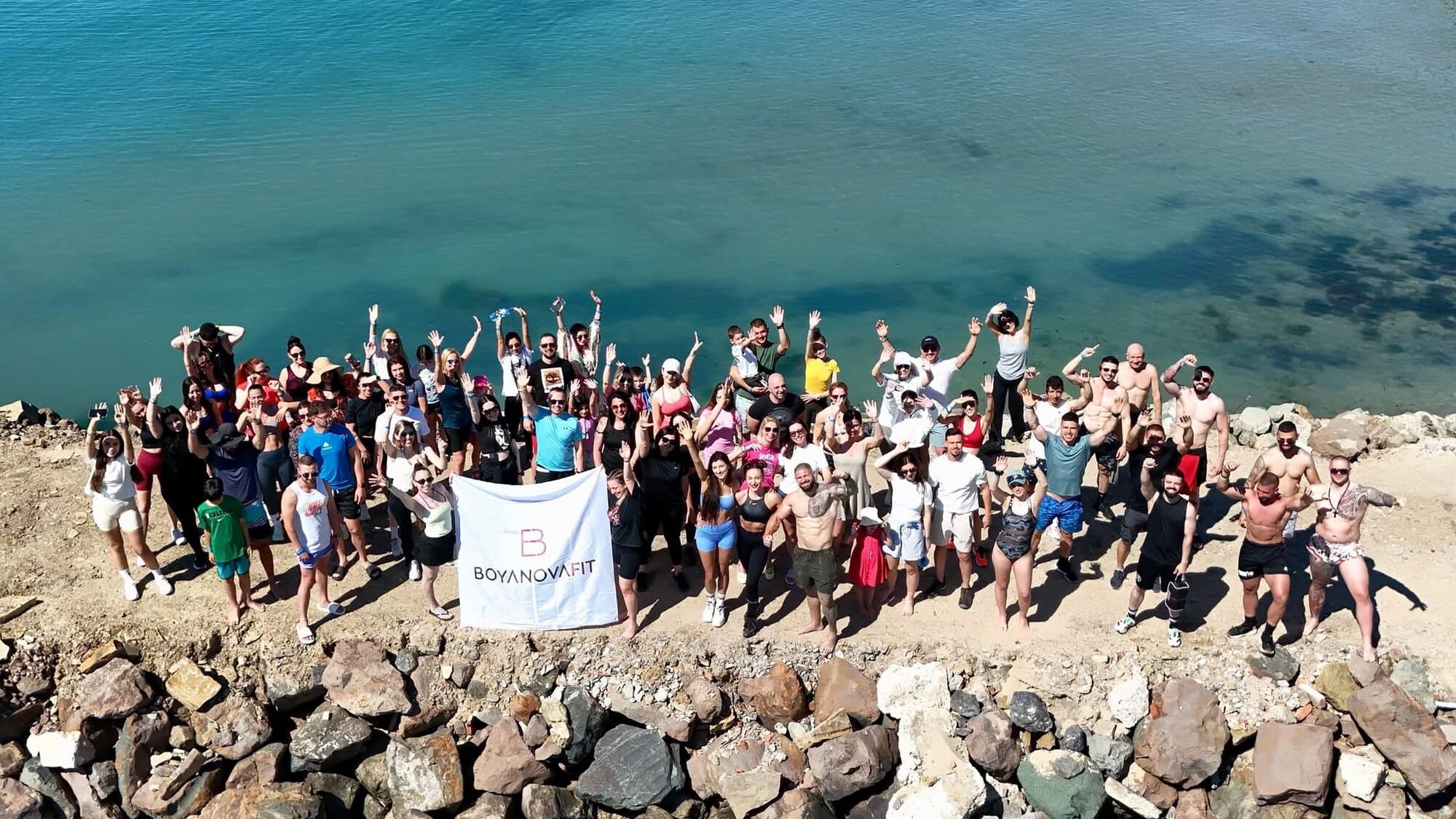 Camp group gathered by the sea at a BOYANOVA active wellness weekend
