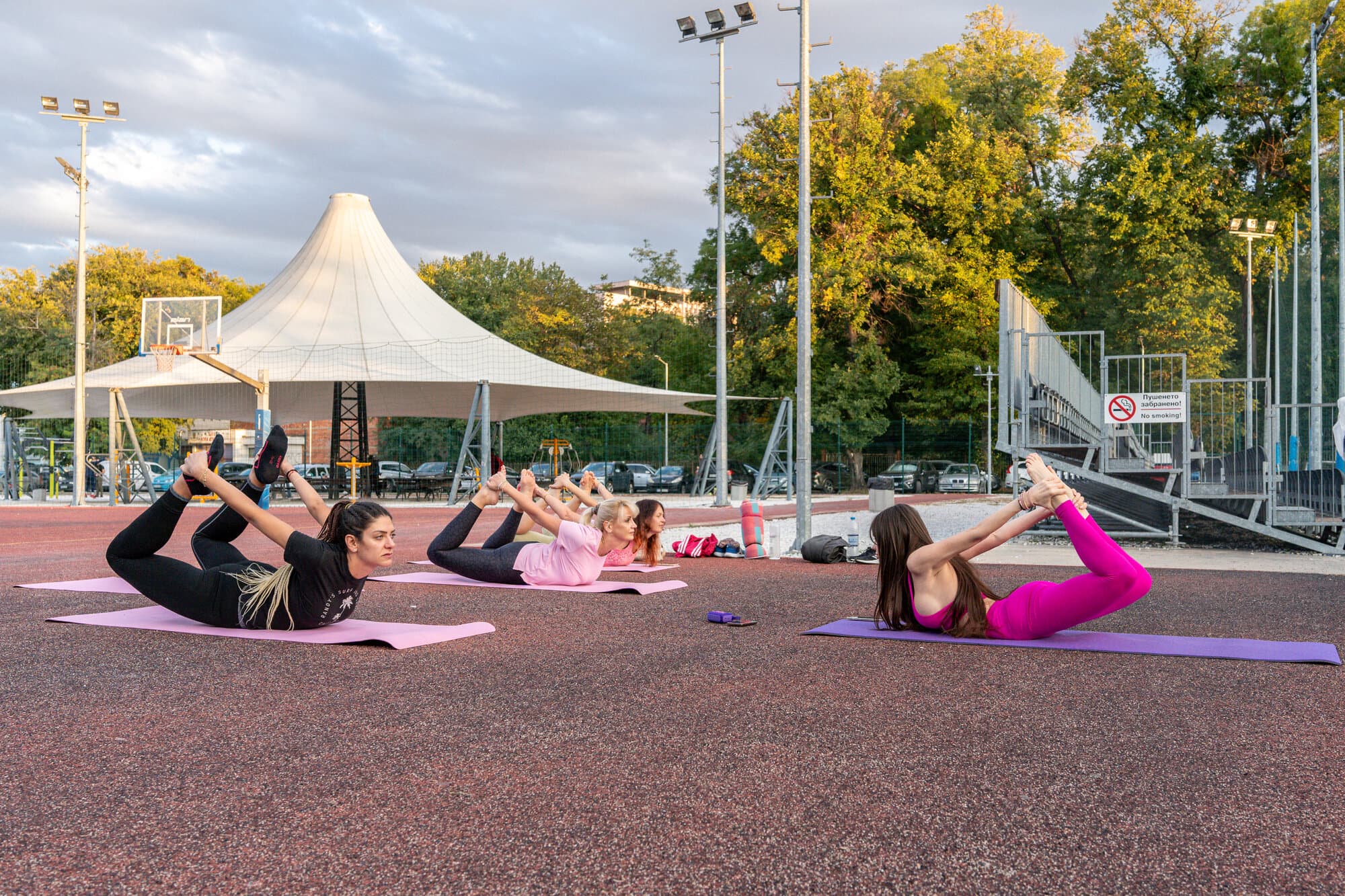 Gülfem's group yoga class practising outdoors at Zala Dunav, Plovdiv